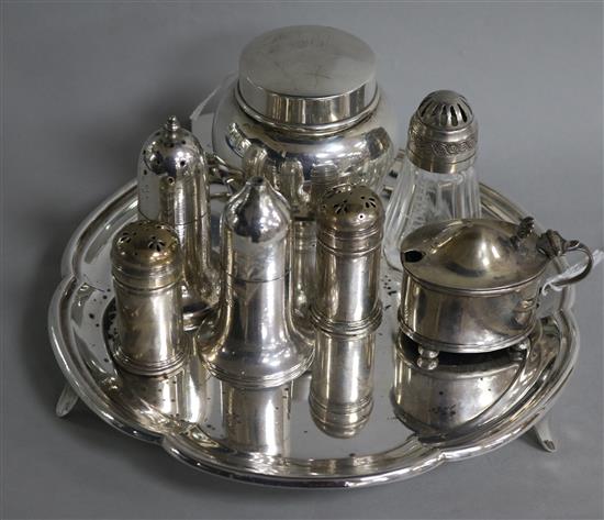 A silver toilet jar and cover, a silver mustard, a pair of Scottish silver peppers, a plated waiter and three plated condiments